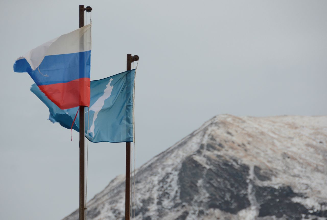 A national flag of Russia and a flag of Russia
