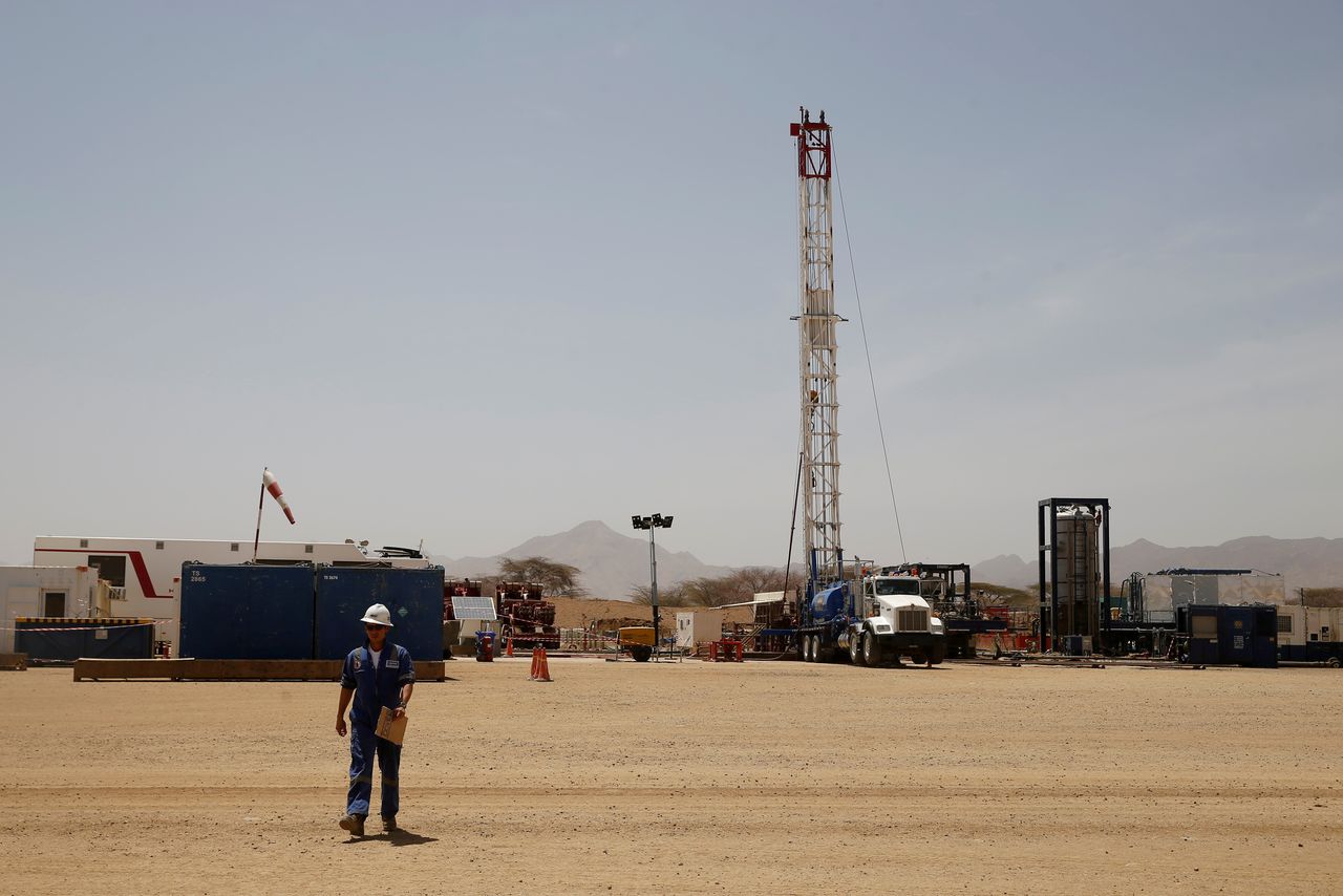 FILE PHOTO: A worker walks at a Tullow Oil explorational drilling site in Lokichar, Turkana County, Kenya, February 8, 2018. REUTERS/Baz Ratner/File Photo